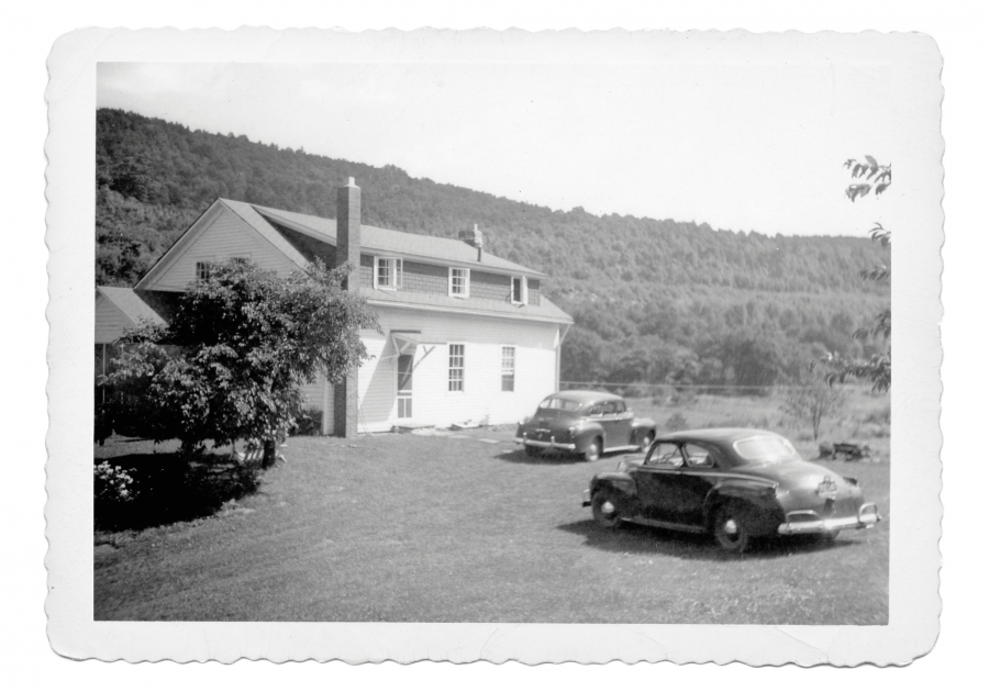 1940s black and white photo of the Dennis farmhouse